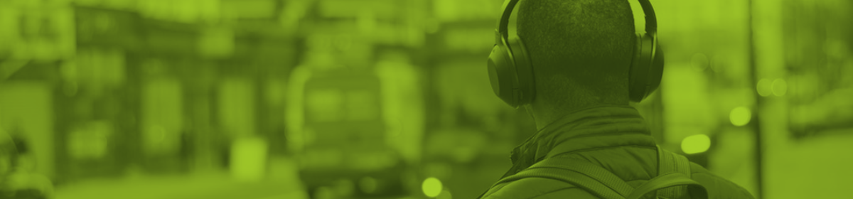 a person viewed from the back wearing headphones